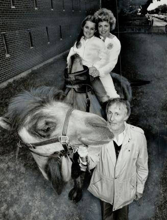 Caravan capers: Casey the camel nuzzles up to broadcaster Don Harron at Caravan's Marrakesh pavillion as Harron led out wife, singer Catherine McKinnon, and daughter Kelley, 11