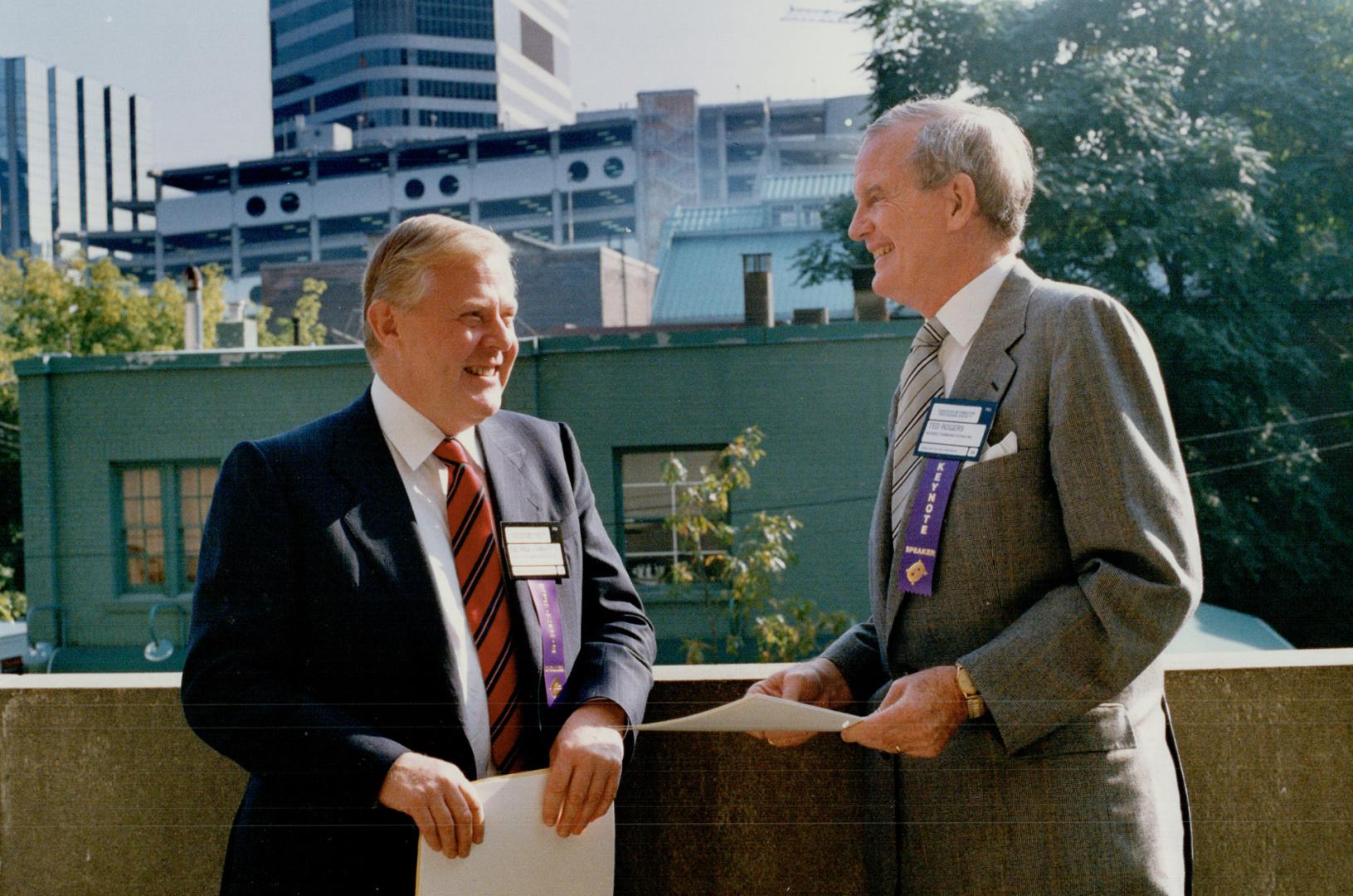 CNCP chairman Ted Rogers, above, and George Harvey, president, inset, will ask Ottawa to let them battle Bell Canada for the long distance telephone dollar. Their promise is to slash rates