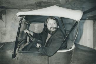 Singer Rompin' Ronnie Hawkins sits at the wheel of his 1926 Ford convertible, which is currently out of service waiting for repairs. Hawkins, 38, is s(...)