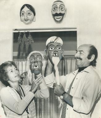 These masks of an old man and woman held by the Hellers, were also made by craftsmen in Sri Lanka