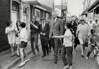 Housing task force tour of Toronto included this inspection of houses in Cabbagetown last October when Transport Minister Paul Hellyer (centre) led hi(...)