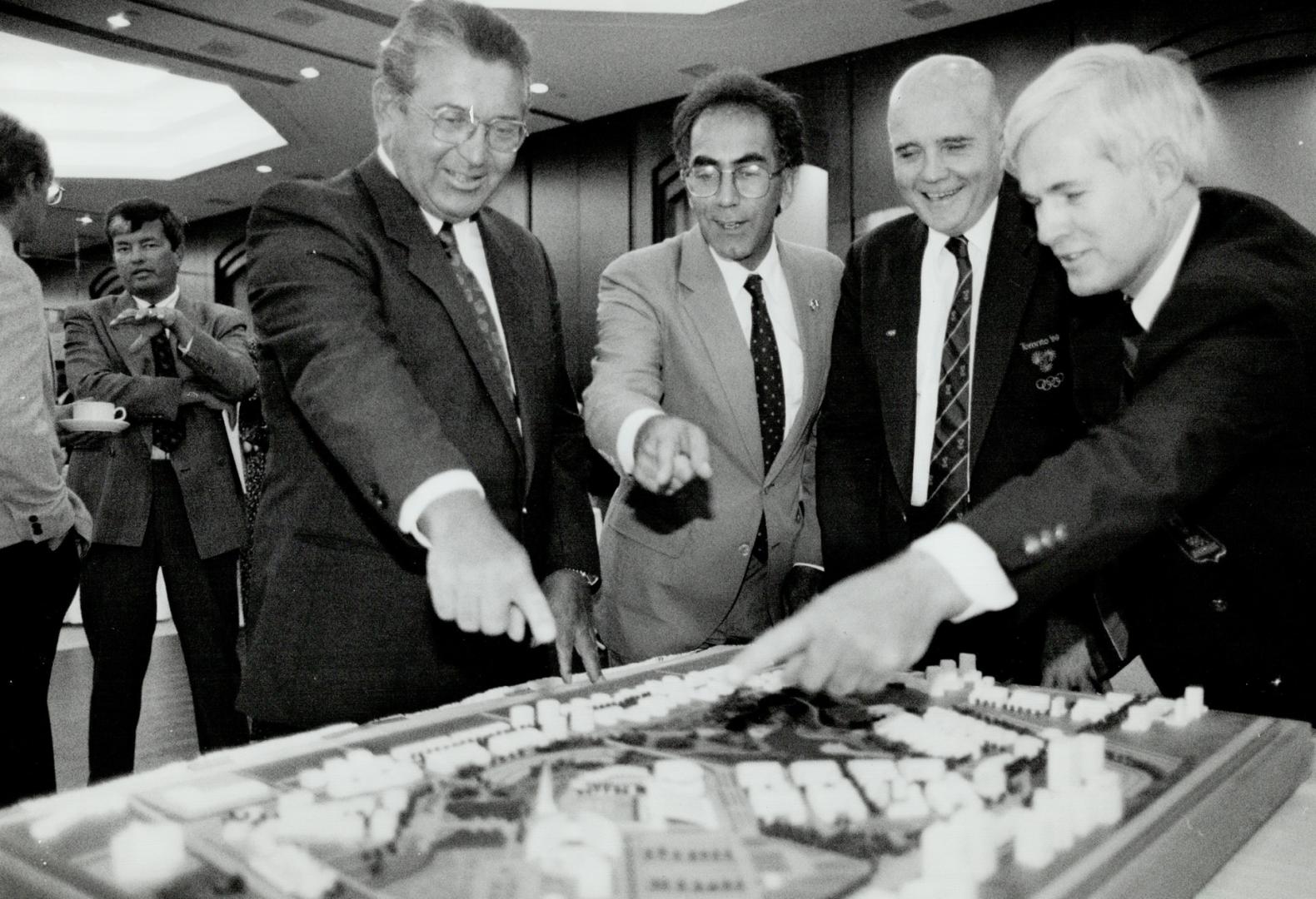 Planned site: From left, Markham Mayor Tony Roman, York Centre MPP Greg Sorbara, Toronto bid leader Paul Henderson and Markham Councillor Jim Jones look at an Olympic village model