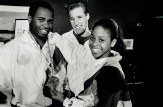 It's all his vault: Curtis Hibbert, left, is joined by fellow gymnasts Rob Doyle and Stella Umeh as he sports bronze medal he won in the vault at a meet in Paris