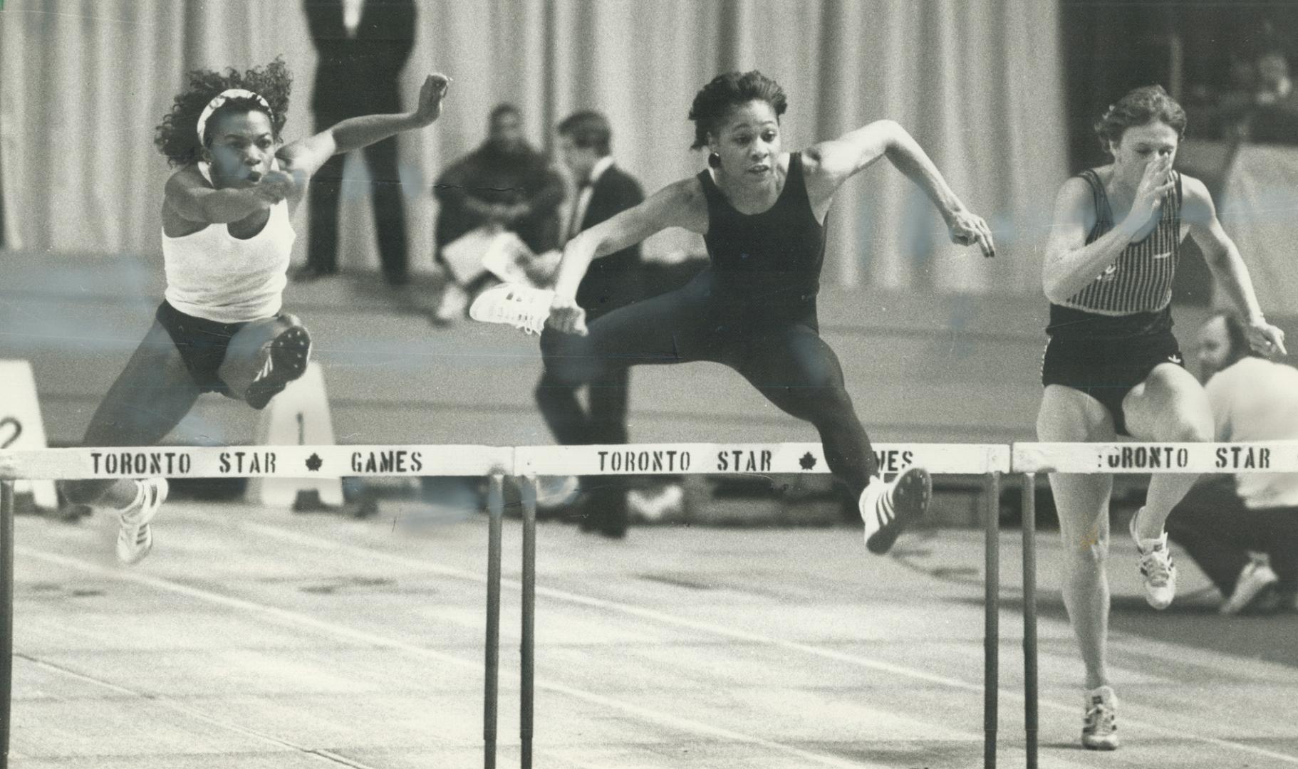 Stephanie Hightower, left, showed the way in women's 50-yard hurdles despite slow start