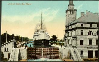 Two steam lakers wait for the water to lower so they can pass through the locks. View is from t…