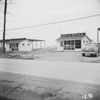 Bank of Montreal and the Bank of Nova Scotia branches, south side of Lawrence Avenue East, west of Donway West