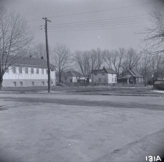 Looking southeast past Willowdale Baptist Church, Olive Avenue, towards houses on Holmes Avenue…