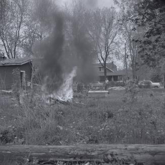 Bonfire, Willowdale Baptist Church, Toronto, Ontario. Image shows a bonfire burning scrap.