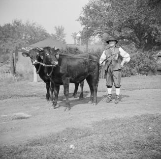 Image shows Charles Morland and a few cattle at Dalziel farm, northwest corner Steeles Avenue a…