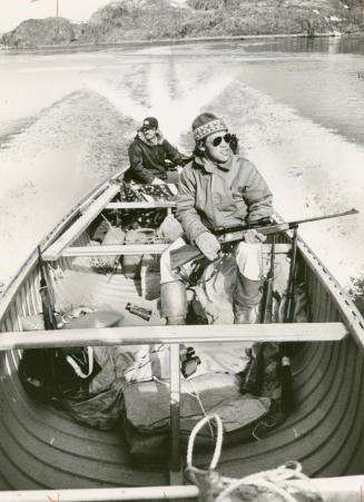 In search of whale: Adamie Veevee, the best hunter in the Cumberland Sound, and Peter Kanayuk (behind) keep watch in their open canoe