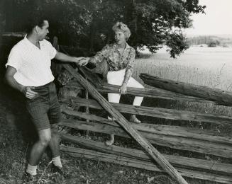 Climbing over fence, Manitowaning, Manitoulin Island, Ontario