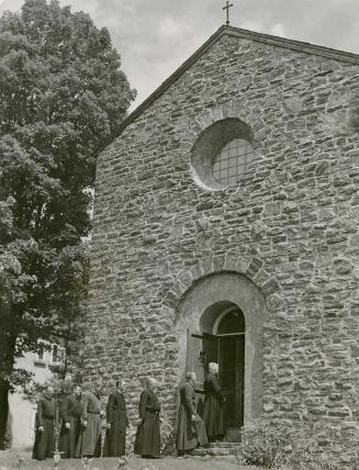 Monks file into the chapel for one of the seven daily periods of prayer, a total of three and three-quarter hours