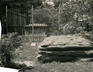 Brant's grave in the Mohawk Church cemetery near Brantford is enclosed with an iron fence