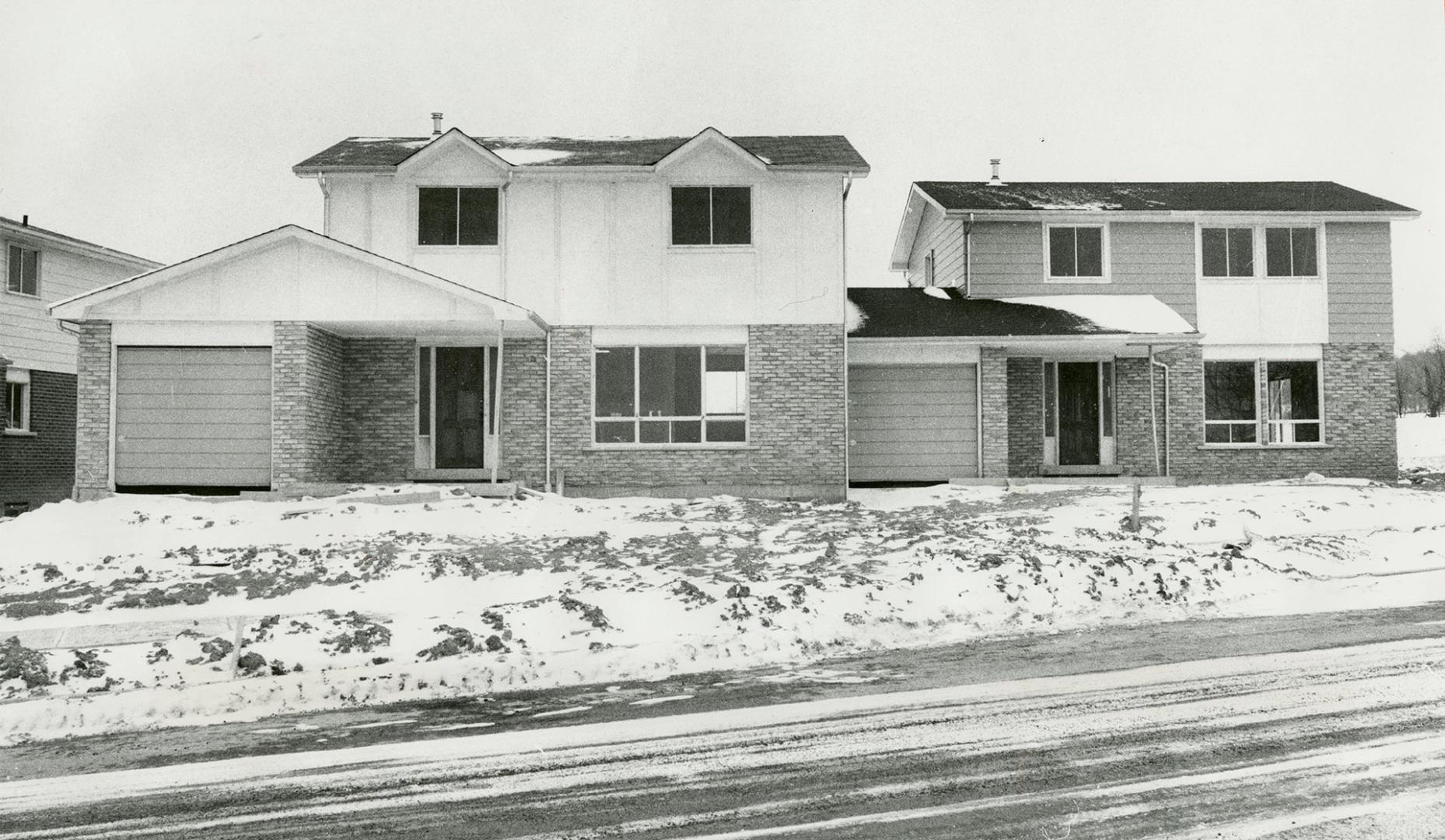 Two attached houses, that appear to be single and detached, are among those offered by a builder in Burlington who has introduced semi-detached houses in an area where single houses predominate