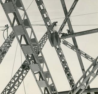 Bridge's 22,000 tons of steel makes intricate pattern against the sky