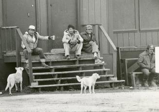 Whitedog residents at work, above, and passing time, above right