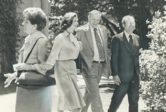 Sunny sign-out: Defeated Liberal cabinet ministers Iona Campagnolo: Jack Horner and Otto Lang stroll in the sunshine after packing up and moving off Parliament Hill yesterday