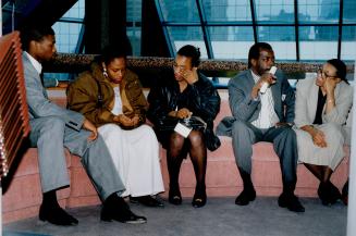 The family of Jonathan Howell sits at Metro police headquarters on College St