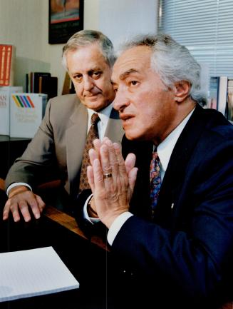 McClellandand Stewart chief Avie Bennett (left) and Mel Hurtig explain the takeover of Hurtig's troubled company at a news conference yesterday