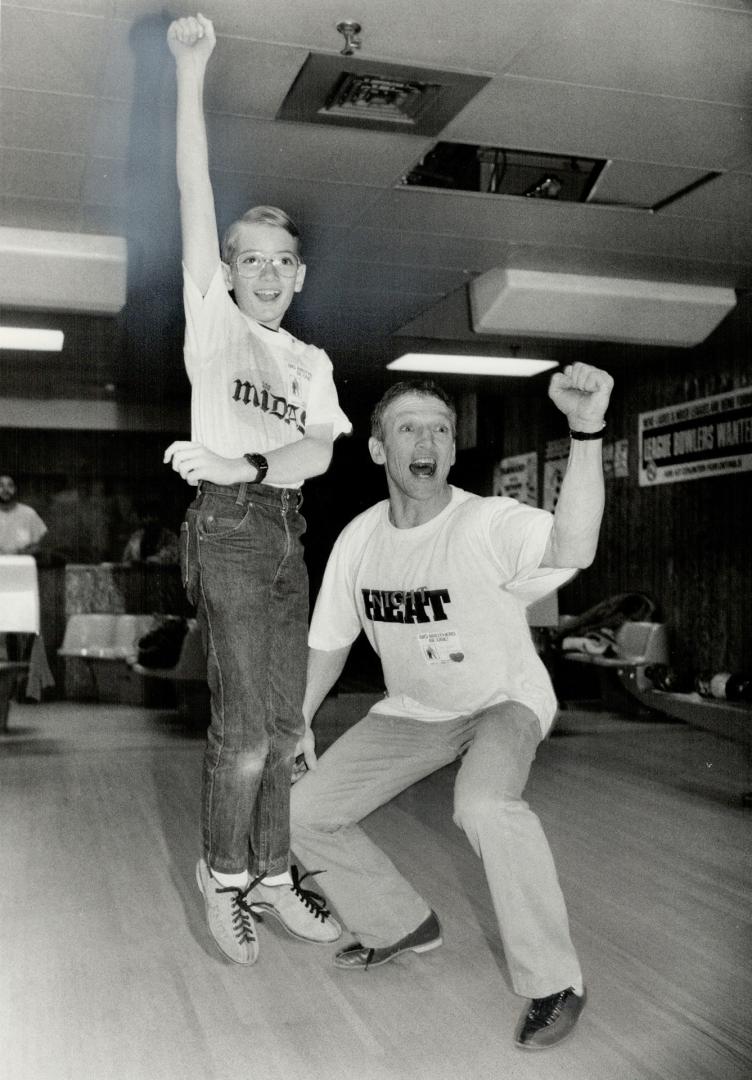 Big and Little brothers bowl for bucks: Actor Scott Hylands bowls with 10-year-old Eddy Sword at Metro Big Brothers' Bowl for Millions Celebrity day at Thorncliffe Bowlerama yesterday