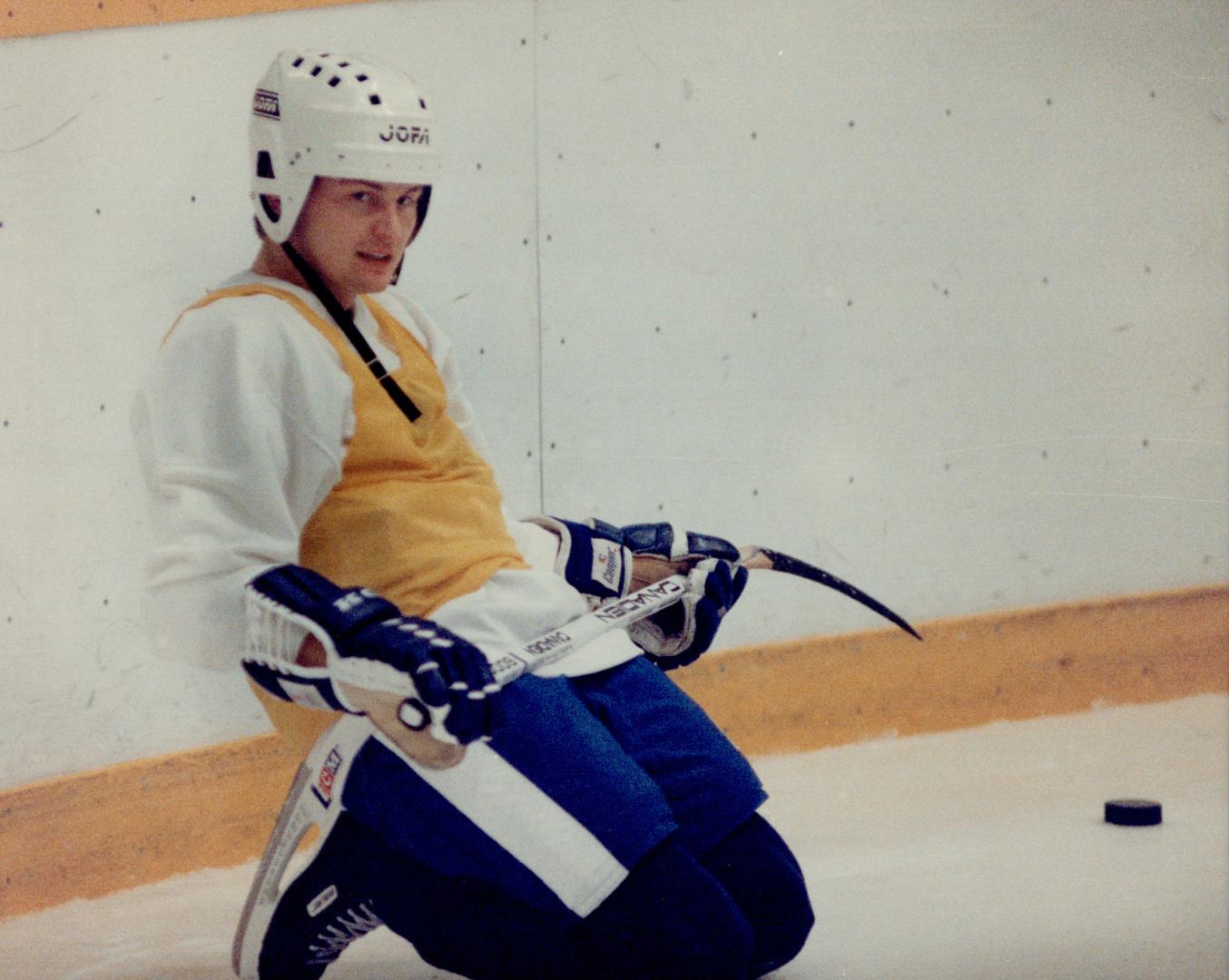 It's hockey in any language: Miroslav Ihnacak, left, may be resting on his knees during his first full Maple Leafs practice yesterday, but he's not resting on his laurels