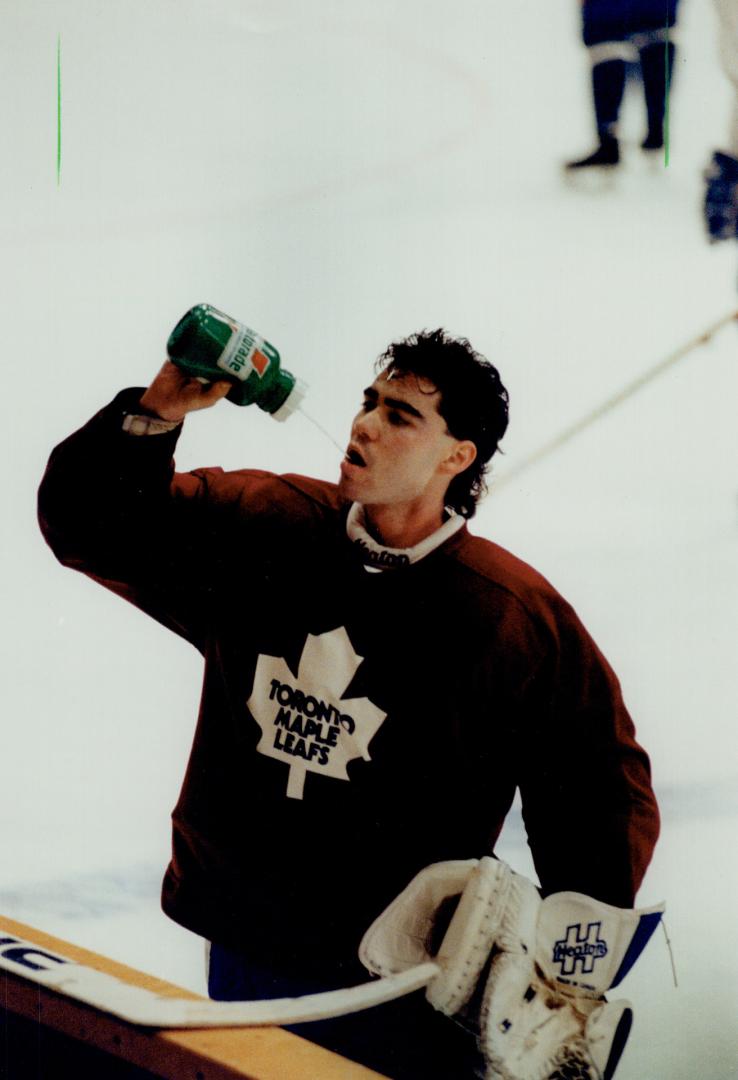 Water Time: Goalie Peter Ing takes break during Leaf practice yesterday at the Gardens