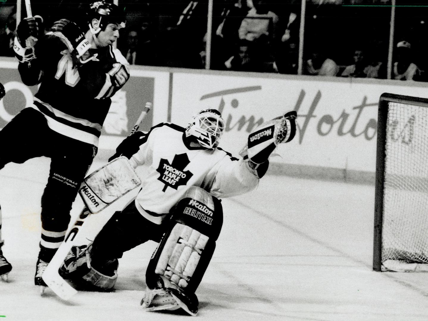 Great Save: Maple Leaf goaltender Peter Ing, with Minnesota's Dave Gagner parked on his doorstep, snares a hot blast to preserve his shutout last night - the first of his NHL career