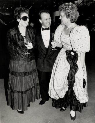 From left to right: all dressed up are university professor Diva Anderson, opera singer Gerald Issac, who performed at the party: and Inge Kern