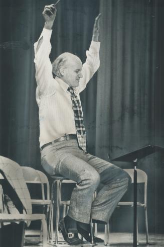 Giving the down beat (or was it an up beat?), Festival Singers conductor Elmer Iseler presided at workshop in Newtonbrook school yesterday when his si(...)