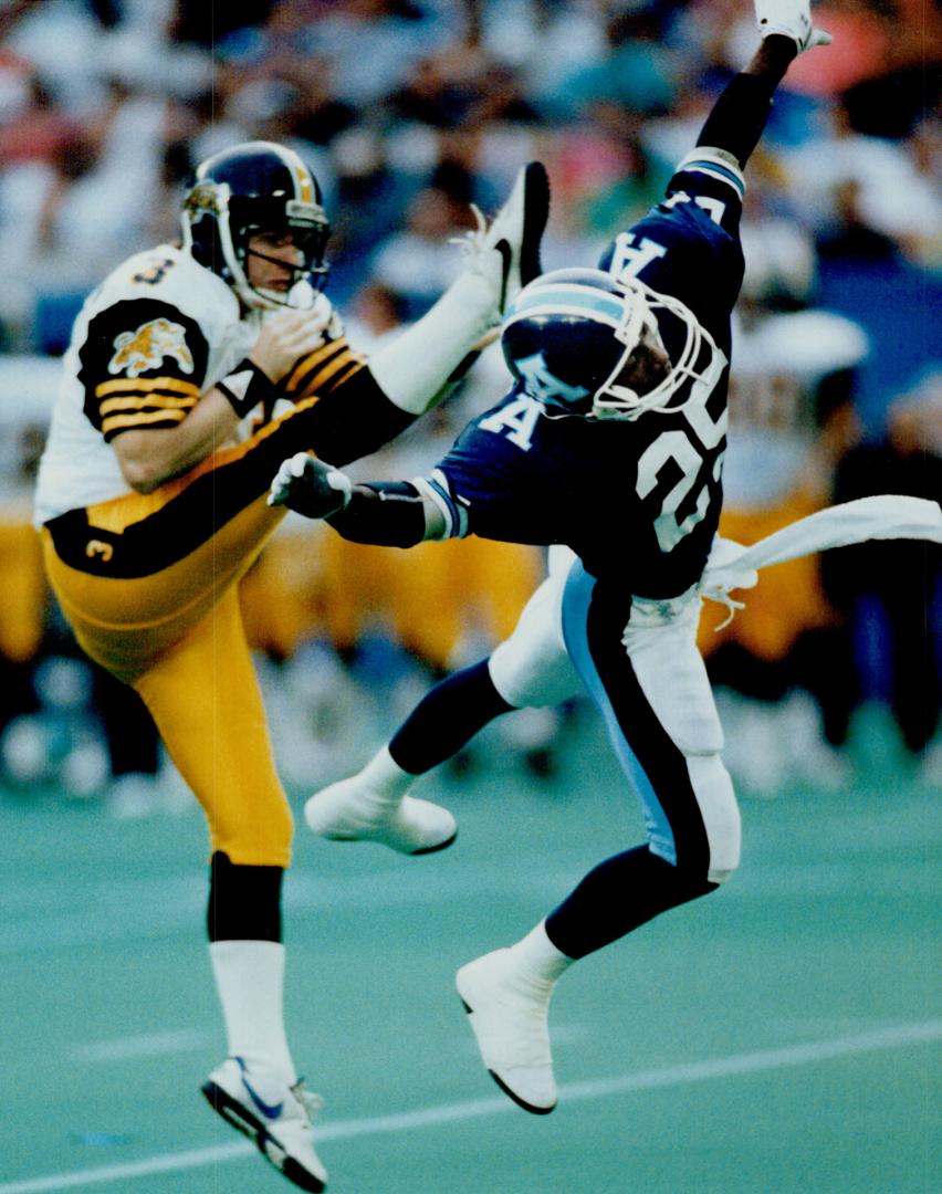 Surprise role: Expected to return punts: Argo's $18 million rookie: Raghib (Rocket) Ismail: tries to block a Hamilton punt during first-half action