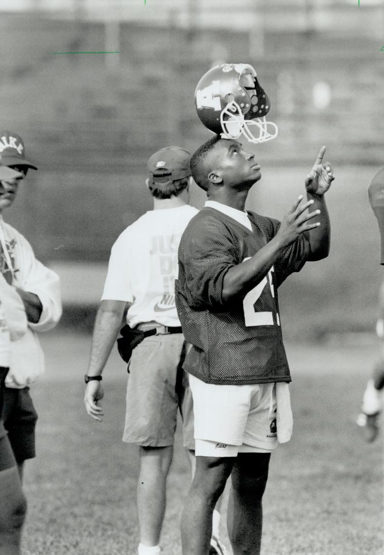 Hats off: Rocket Ismail tries balancing act at Argos practice