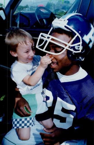 A Nose for Football: Argo fan Donald Wamboldt: 4: gives receiver Rocket Ismail's nose a tweak after the club's practice session at Burnhamthorpe Collegiate