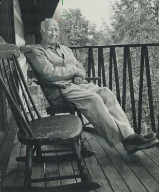 The painter likes to sit in 100-year-old Quebec rocker on porch and gaze at trees