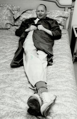 A travelling man. British singer or songwriter Joe Jackson relaxes in his Toronto hotel room in preparation for his concert tonight in the Kingwood Music Theatre at Canada's Wonderland