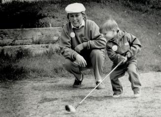 In the swing of things. Vaughan Mayor Lorna Jackson had a few tips for 23-month-old Bradley Merritt when she was at Uplands Golf Course last week to l(...)