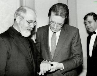 Timely gift: Rev. Lawrence Jenco shows Toronto Mayor Art Eggleton the watch he received from hostage negotiator Terry Waite following release by terrorists in Beirut