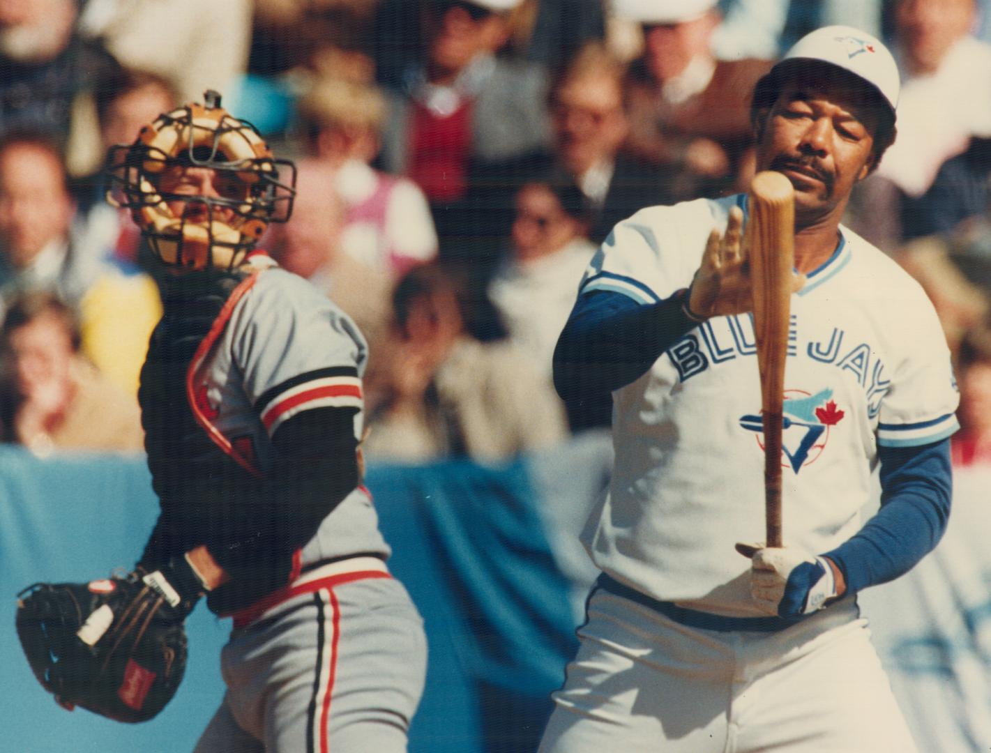 Blue Jays' designated hitter Cliff Johnson may well be asking where did all the hits go, as he studies his bat during yesterday's home opener at Exhib(...)