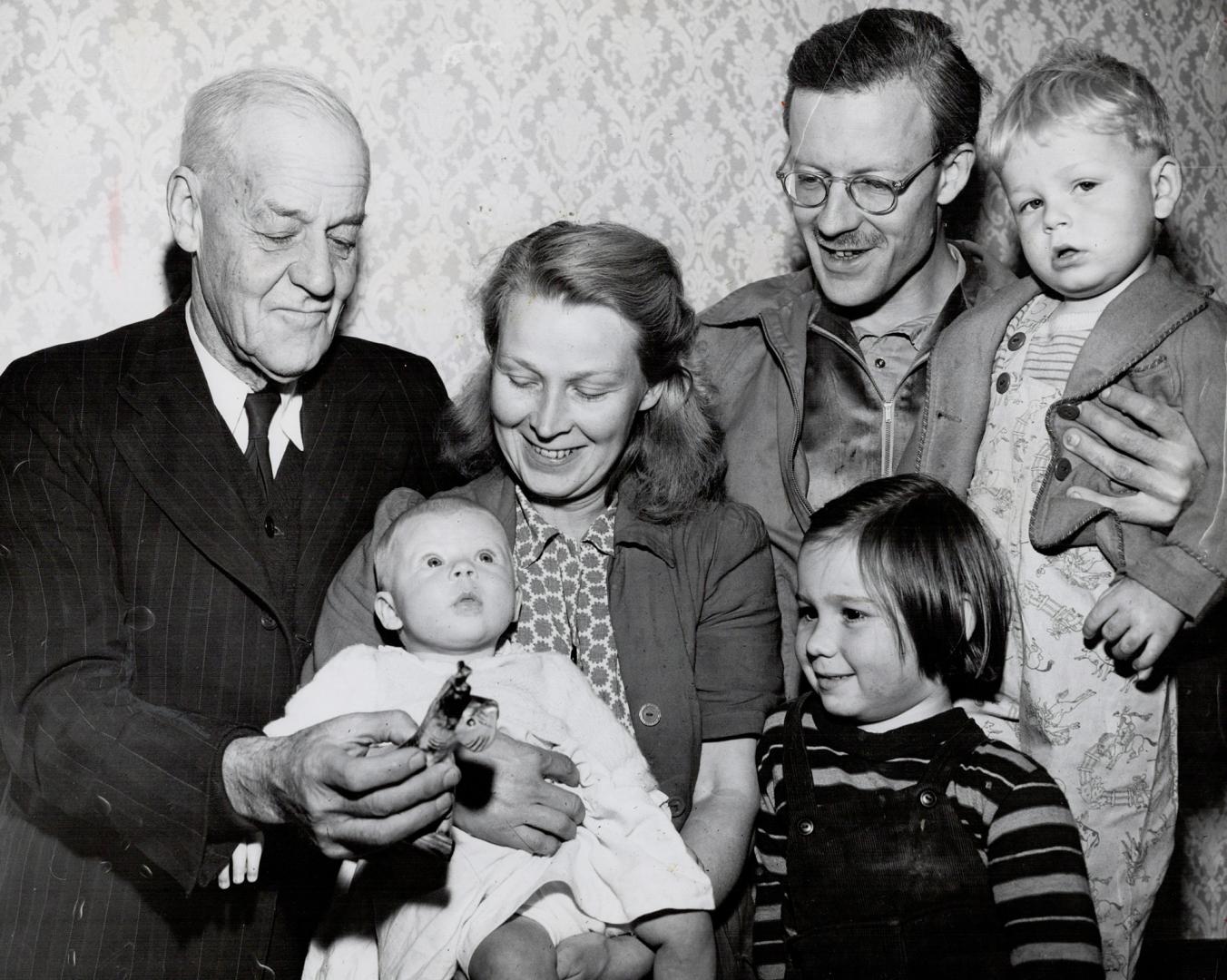 Three generations of the Jolliffe family are shown reunited on the old farm homestead