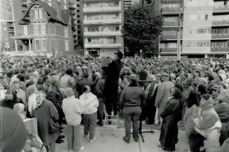 Trip through time: A huge crowd listens yesterday as Star columnist Donald Jones describes the Victorian past of Jarvis St