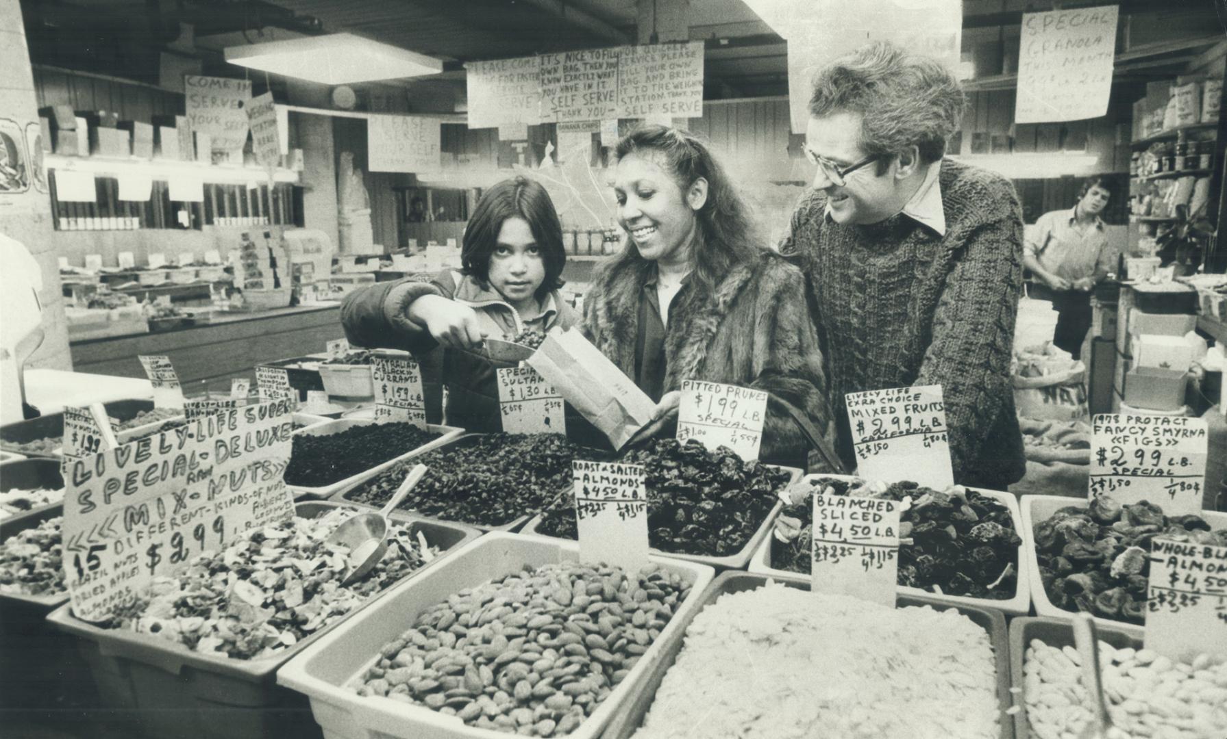 Reporter Frank Jones, his wife Ayesha, and their daughter Fazia, 10, shop vegetarian at the St