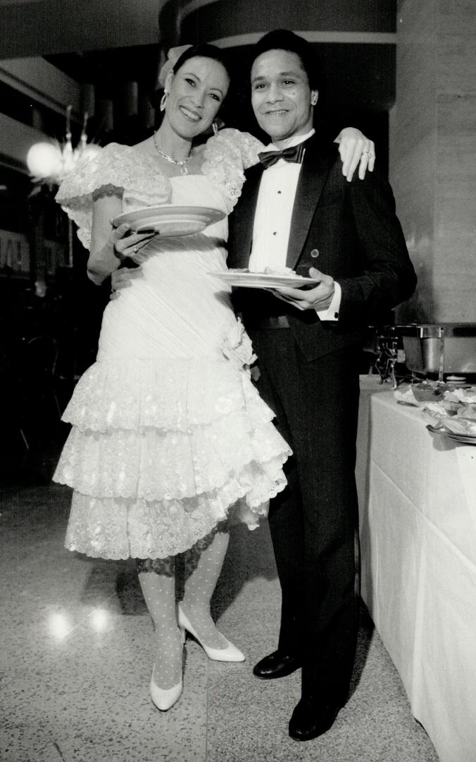 Above, discussing their performances at the buffet table are principal dancers Karen Kain, in a Maggy Reeves dress, and Kevin Pugh