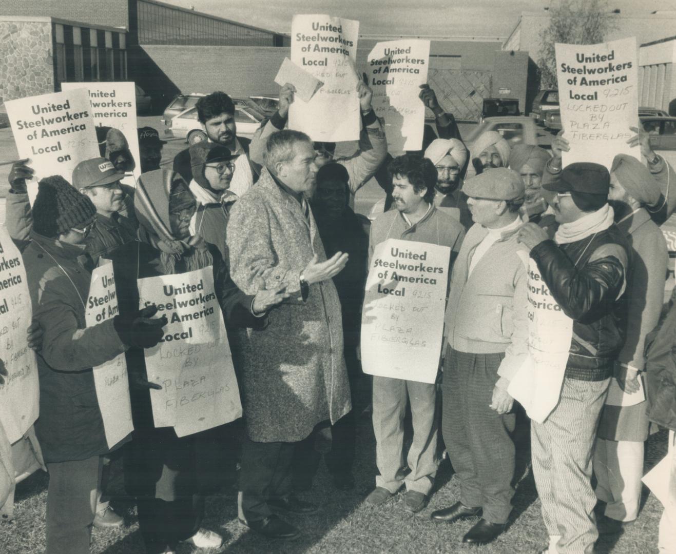 Federal Liberal candidate Robert Kaplan (left) talks to pickets today at a North York plastics firm after they were locked out. They told him the plan(...)