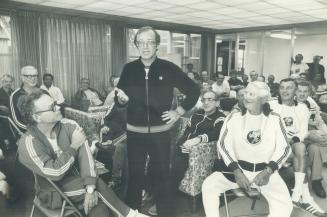 Dr. Terry Kavanagh (standing) and his track club