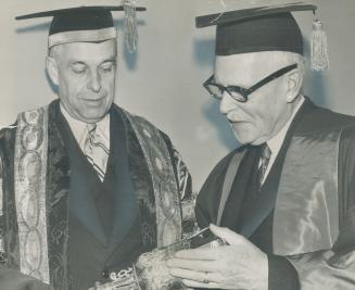 Prime minister St. Laurent received an honorary doctorate of laws when he attended a McMaster university convocation last night. Mr. St. Laurent also (...)