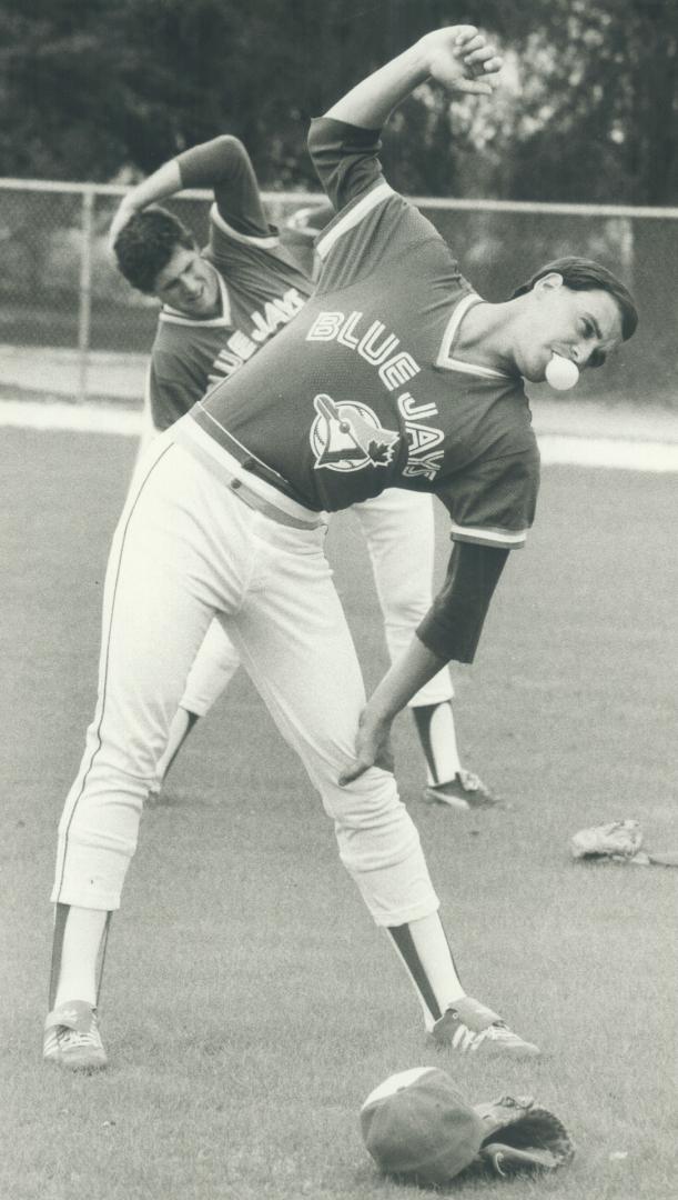 Blowing bubbles: Jimmy Key, who could be the Blue Jays' fifteh starter or return tot he bullpen, blows bubbles during warmup exercises at the Jays' training facility in Dunedin, Fla