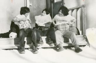 Eagerly looking forward to a 1,500-mile trip to Toronto this year, three eleven year old Cree youngsters at Muskrat Dam don Toronto T-shirts given them by a Star Photographer