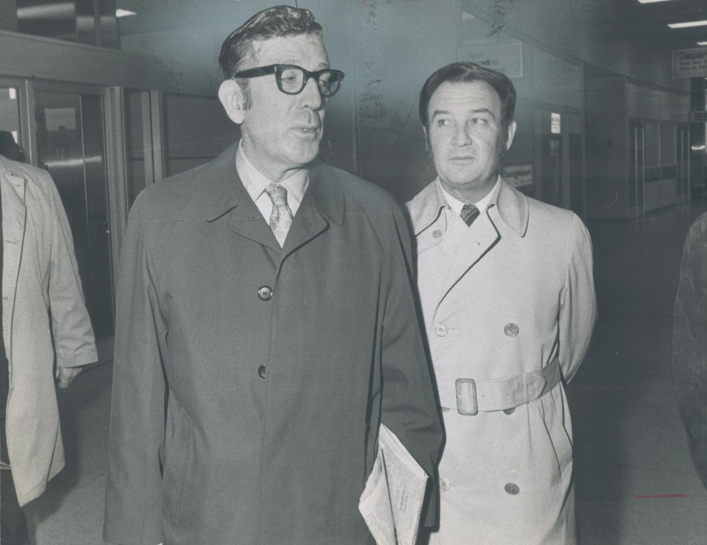 Here to bargain with General Motors, United Auto Workers union president Leonard Woodcock (left) walks with Canadian UAW vice-president Dennis McDermott