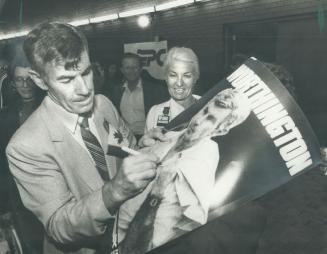 Out, but down? Broadview-Greenwood PC candidate Peter Worthington autographs a poster for a fan on election night