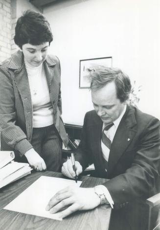 Ed Zimba signs nomination papers with NDP party secretary Penny Dickens