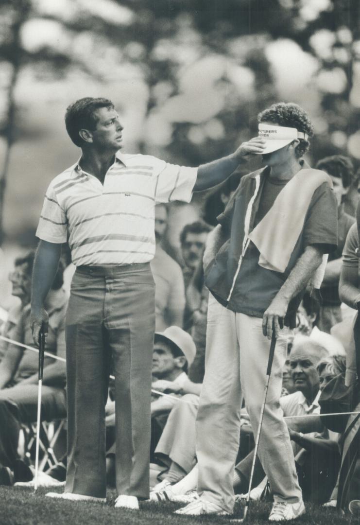 I'm the boss: Fuzzy Zoeller, left, and his caddy ham it up for the gallery during yesterday's third round of the Canadian Open at Glen Abbey